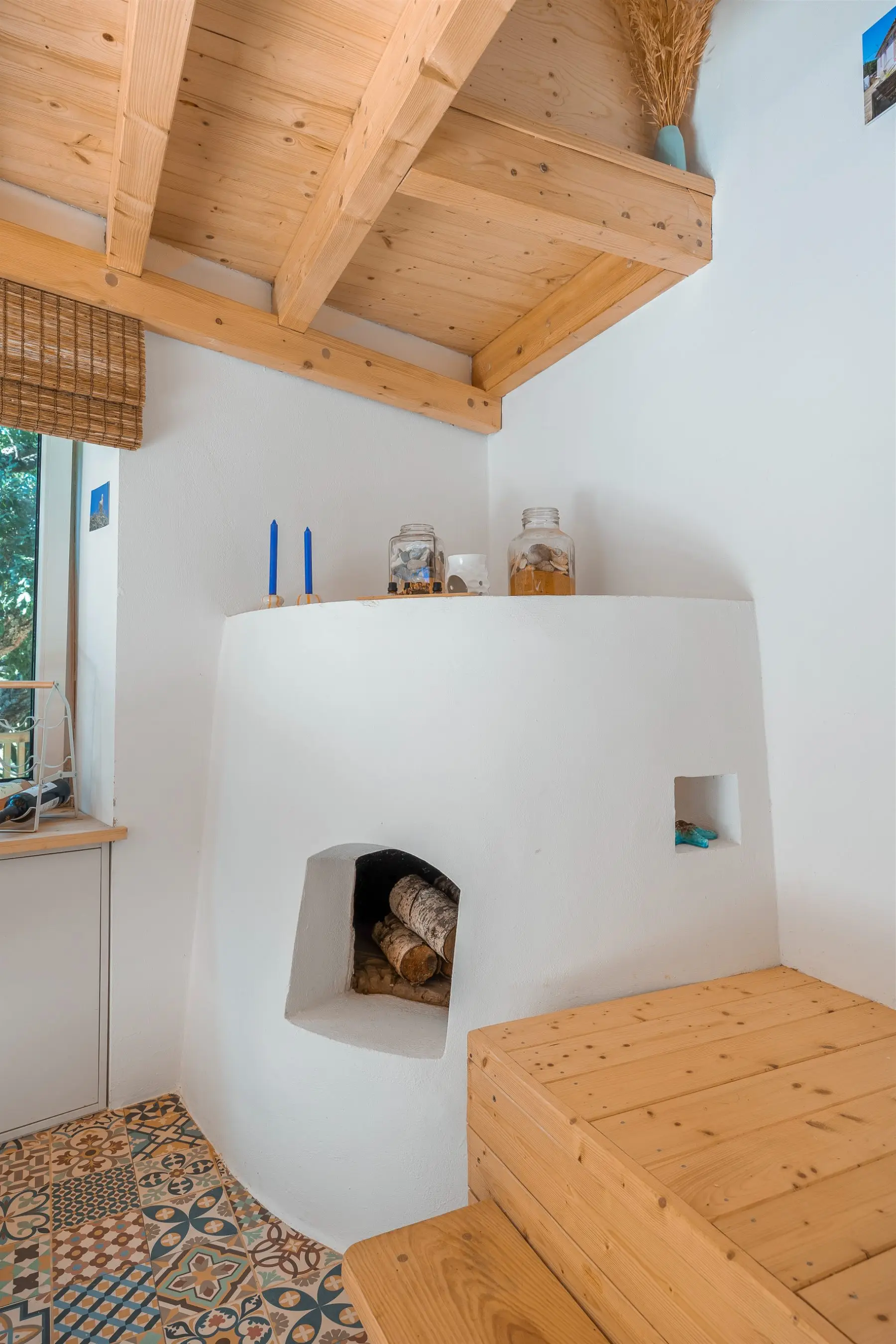 The original stone oven, plastered white, in the summer for atmosphere, in the winter warmth